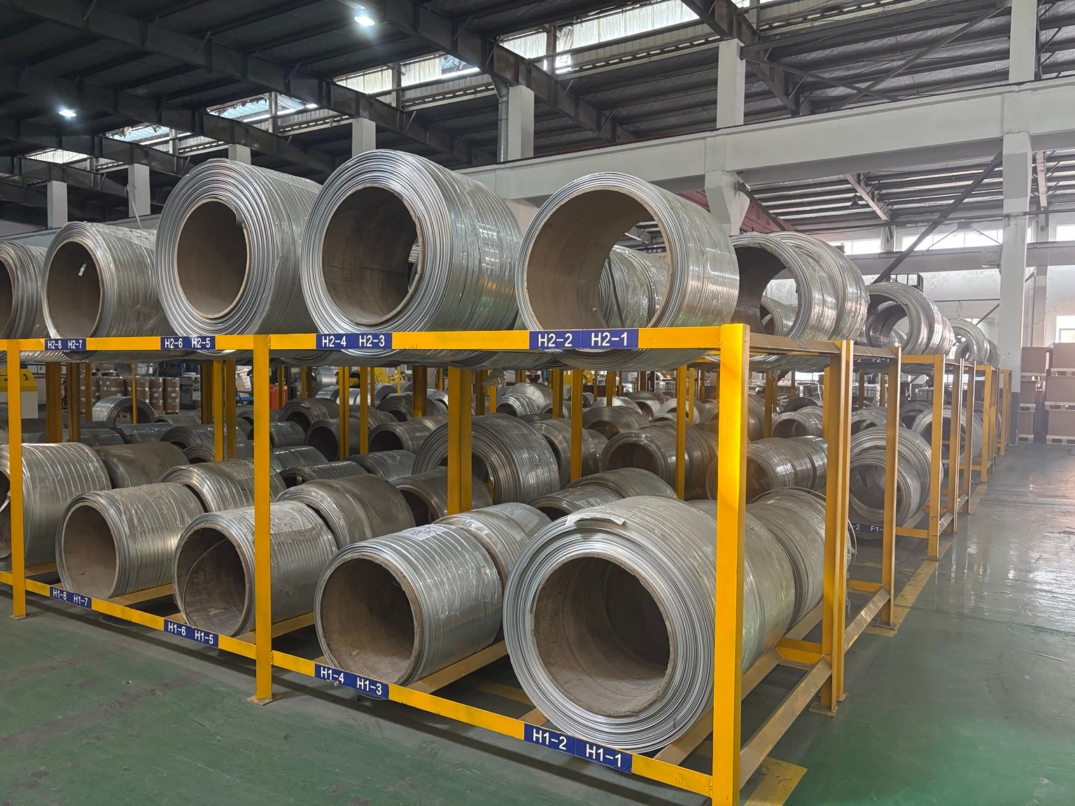 Aluminium coils organised on material storage racks